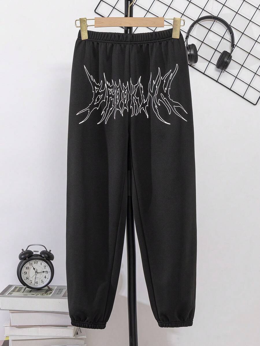 Tween Boy's Street Element Printed Jogger Pants With Transforming Letters And Elastic Cuffs - Black - View 1