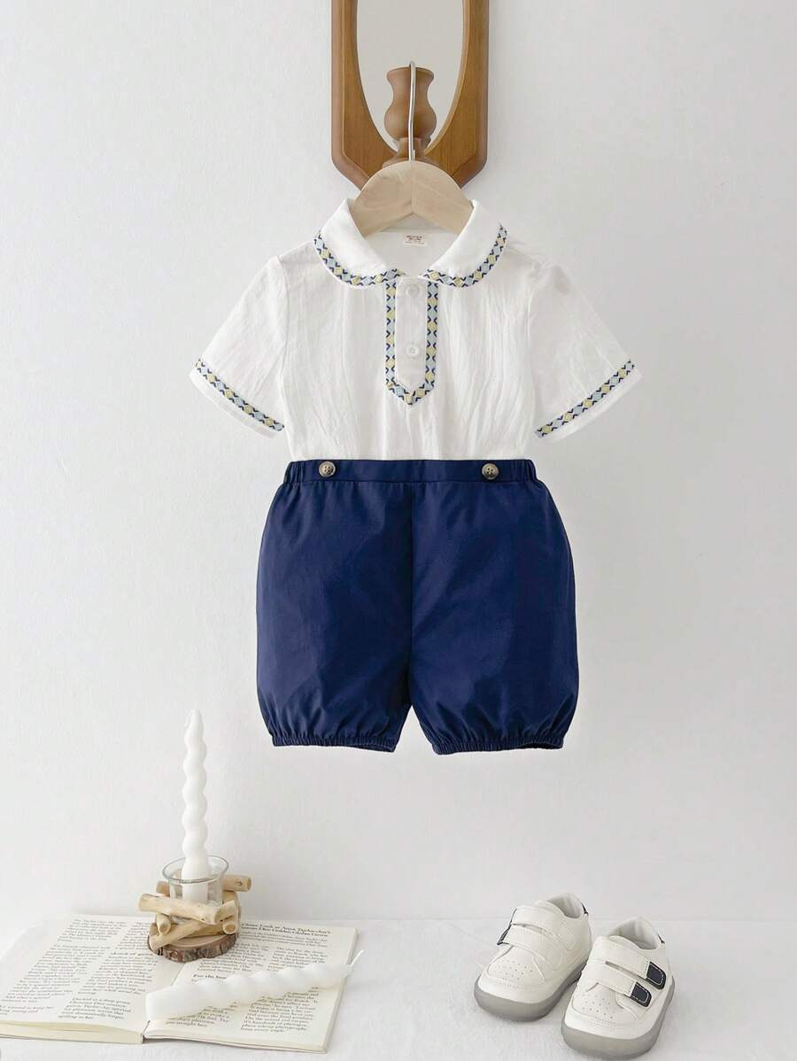 Cozy Pixies Baby Boy, Color Blocking Peter Pan Collar Short Sleeve Half-Zip Pullover Top And Bubble Shorts Set - Blue - View 1