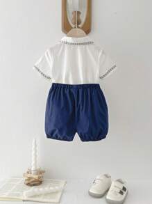 Cozy Pixies Baby Boy, Color Blocking Peter Pan Collar Short Sleeve Half-Zip Pullover Top And Bubble Shorts Set - Blue - View 2