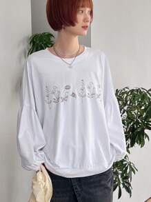 FRIFUL Camiseta casual holgada de mujer con cuello redondo, mangas farol y estampado floral, para primavera/verano y otoño, blusas de manga larga con gráficos para mujeres - Beis - Ver 1
