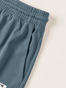 Manfinity Homme Hombres verano deportes y ocio camiseta de manga corta de cuello redondo impreso de bloques de color letras y pantalones cortos