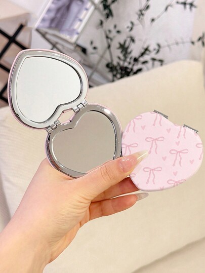 Kawaii 1 pieza Espejo compacto de maquillaje con forma de corazón de PU con moño rosa, patrón aleatorio