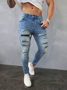 Manfinity LEGND Jeans vaqueros slim fit de hombre de color azul claro lavado y desgastado