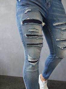 Manfinity LEGND Jeans vaqueros slim fit de hombre de color azul claro lavado y desgastado