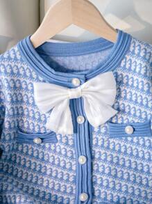 SHEIN 2pcs/Set Young Girl Knitted Cardigan Sweater And Mini Skirt Outfit, New Fashion For Fall/Winter. The Light Blue Soft Fabric And Gentle Pattern Make The Garment Elegant And Sweet. The Charming Bow Adds A Lively And  Touch. The Buttons Are Exquisite And Luxurious. Suitable For Wearing In Autumn And Winter. The Soft And Skin-Friendly Material Is Lightweight And Comfortable, Making It More Cozy To Wear. Suitable For Various Occasions, The Cardigan Is Easy To Put On And Off To Better Adapt To The Autumn And Winter Climate, And The Mini Skirt Can Be Matched With Other Styles To Show The Academic Good Girl Vibe, Suitable For Home Leisure, Campus Gatherings, Street Walks, Holiday Parties, And More. - Blue - View 3