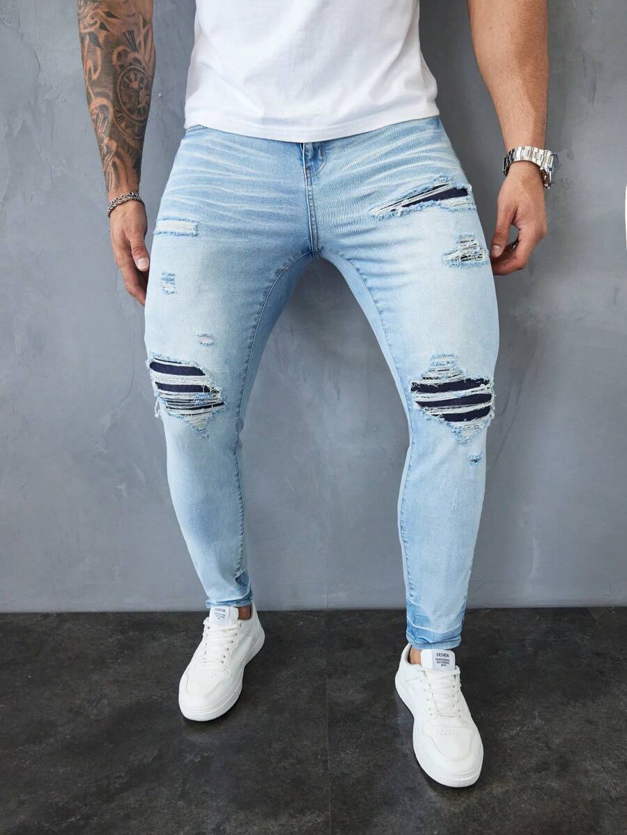 Manfinity LEGND Jeans pitillo de denim azul claro desgastados para hombres - Lavado ligero - Ver 1