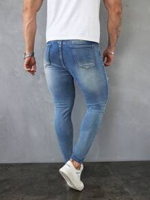 Manfinity LEGND Jeans vaqueros slim fit de hombre de color azul claro lavado y desgastado