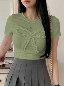 DAZY Camiseta casual de mujer de manga corta con lazo y unicolor, blusas gráficas estilo preppy