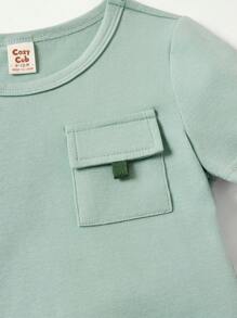 Cozy Pixies Ensemble de haut à manches courtes à encolure ronde et à poche décorative douce tricotée pour bébé garçon et short unicolore de couleur unicolore