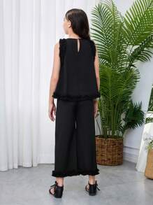SHEIN Set da 2 pezzi per ragazze giovani, con top senza maniche con scollo tondo e pantaloni casual e larghi, in maglia con contrasto - nero - Visualizzare 2