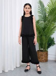 SHEIN Set da 2 pezzi per ragazze giovani, con top senza maniche con scollo tondo e pantaloni casual e larghi, in maglia con contrasto - nero - Visualizzare 7
