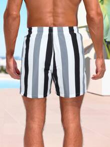 Manfinity Swimmode Pantalones cortos holgados para playa con cordón en la cintura, con diseño de letras y rayas para hombres