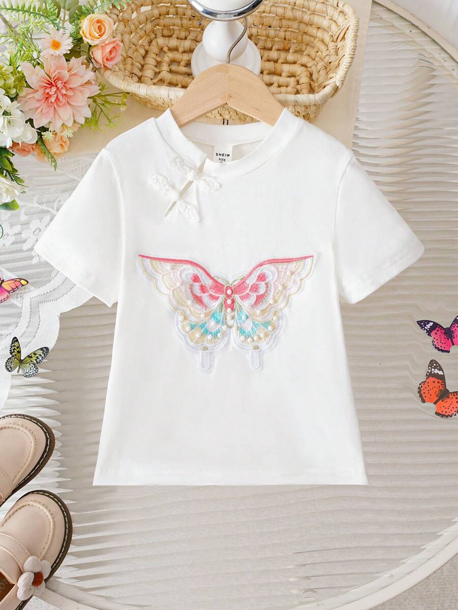 T-shirt à col rond et manches courtes pour tout-petites filles, avec décoration de cheongsam brodée d'un joli nœud, style chinois