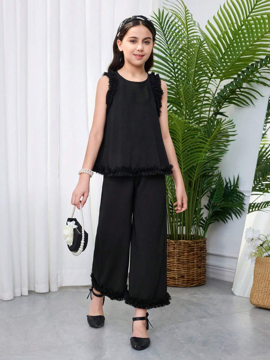 SHEIN Set da 2 pezzi per ragazze giovani, con top senza maniche con scollo tondo e pantaloni casual e larghi, in maglia con contrasto - nero - Visualizzare 1