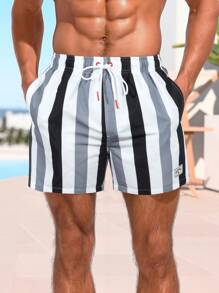 Manfinity Swimmode Pantalones cortos holgados para playa con cordón en la cintura, con diseño de letras y rayas para hombres