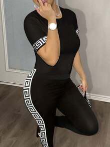 Slaydiva Summer Casual Simple Basic Round Neck Short-Sleeved Cuff Printed Fitted T-Shirt Slim Trousers With Back Print On The Side Black And White Printed Black Knitted Women's Two-Piece Set-I