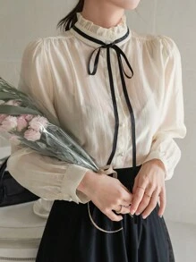 DAZY Blusa elegante y encantadora de contraste de color con cuello alto, lazo, cordón y manga larga para mujer