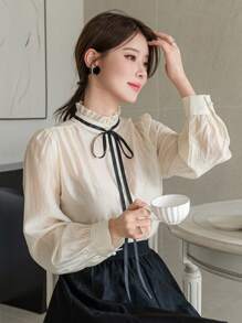 DAZY Blusa elegante y encantadora de contraste de color con cuello alto, lazo, cordón y manga larga para mujer