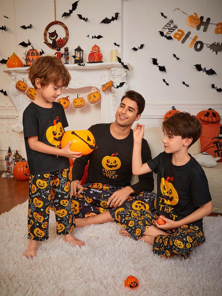 SHEIN Young Boy Halloween Theme Cartoon Pumpkin Print Short Sleeve Pants Casual Flame Retardant Pajama 2-Piece Set, Daddy And Me Matching Outfits (3 Sets Are Sold Separately) - Black - View 1