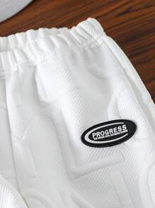 SHEIN 3pcs Young Boy Casual Loose Sport Sweatsuit Set - Includes 1pc Long Sleeve Crew Neck Sweatshirt With Embroidered Letter Graphic, 1pc Asymmetrical Crossbody Bag, And 2pcs Solid Color Sweatpants With Contrast Trim Details, Comfortable And Warm For Fall/Winter Daily Wear, School Or Outdoor Play