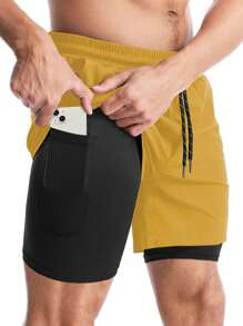 Manfinity Fitness Shorts deportivos de bolsillo de unicolor y estilo informal para hombre