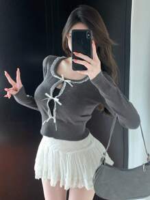 DAZY Suéter de cuello redondo de manga larga para mujer con empalme de color en contraste, calado y adorno de lazo, ropa de mujer para otoño