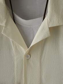 Manfinity Homme 男士短袖寬鬆純色翻領鈕扣休閒襯衫，適用於夏季