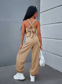 SHEIN Trendy Tween Girl geweven effen kleur jumpsuit met gekruiste rugbanden, mouwloos voor lente/zomer casual streetstyle