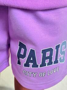 SHEIN Explorewe 女童紫色长袖运动衫和休闲裤套装，这款女童紫色长袖运动衫休闲套装采用清新的紫色色调和时尚的字母印花设计，是女孩日常穿着和活动的理想选择。胸前简洁优雅的字母设计与整体紫色色调相得益彰。配套的短裤也采用相同的清新紫色，营造出统一和谐的外观。整体设计简洁优雅，充满青春活力，适合日常休闲穿着、户外旅行和户外活动，适合秋冬季节。