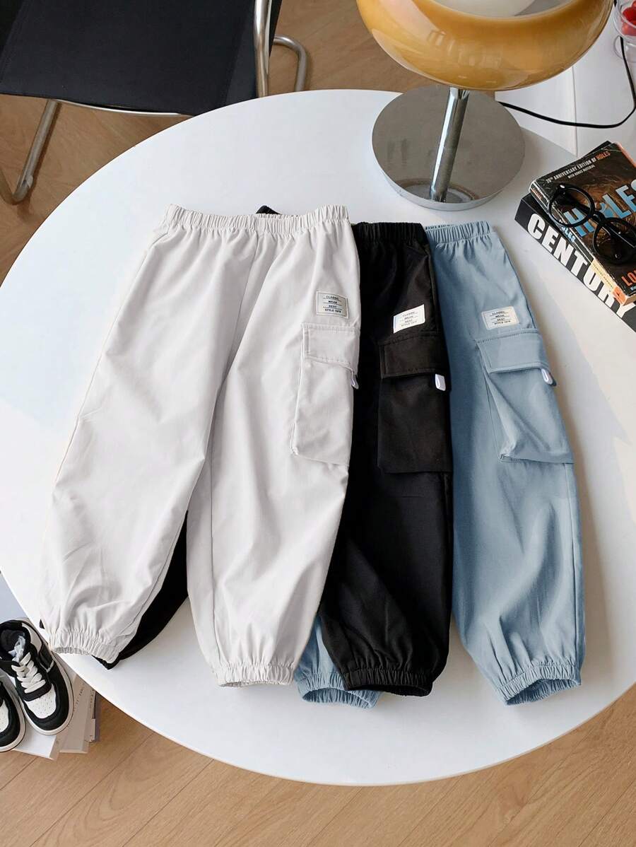 SHEIN 3 piezas/set Pantalones deportivos informales de estilo urbano para niños pequeños con decoración gráfica en inglés y pierna ancha, adecuados para actividades al aire libre, escuela, todas las estaciones - Azul - Ver 1