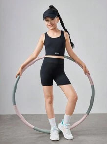 SHEIN Conjunto de ropa deportiva para niña preadolescente con top corto de unicolor y shorts - Negro - Ver 4