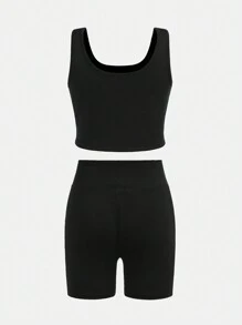 SHEIN Conjunto de ropa deportiva para niña preadolescente con top corto de unicolor y shorts - Negro - Ver 9