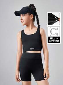 SHEIN Conjunto de ropa deportiva para niña preadolescente con top corto de unicolor y shorts - Negro - Ver 1