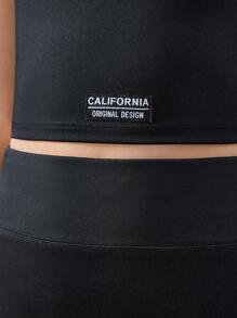 SHEIN Conjunto de ropa deportiva para niña preadolescente con top corto de unicolor y shorts - Negro - Ver 6