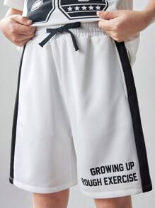 SHEIN Conjunto de 2 piezas para niño preadolescente con camiseta de manga corta con estampado gráfico holgada informal y pantalones cortos