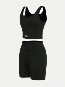 SHEIN Conjunto de ropa deportiva para niña preadolescente con top corto de unicolor y shorts - Negro - Ver 23
