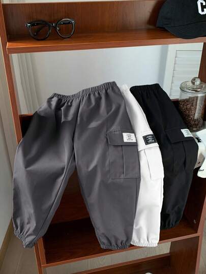 SHEIN 3 件装年轻男孩休闲运动街头风格宽松版型黑色抽绳裤、海军蓝抽绳裤和白色抽绳裤，适合春、夏、秋、冬季日常穿着、上学、旅行、运动