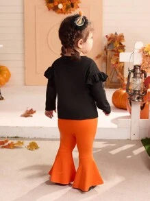 SHEIN 2pcs Baby Girl Halloween Cute Knit Cartoon Pattern Top And Orange Flared Pants Set. Mommy And Me Matching Outfits (2 Sets Sold Separately) - Black - View 2