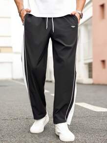 Manfinity Homme Pantaloni casual da uomo oversize con ricamo di lettere, strisce laterali e vita con laccio, con tasche