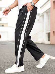 Manfinity Homme Pantaloni casual da uomo oversize con ricamo di lettere, strisce laterali e vita con laccio, con tasche