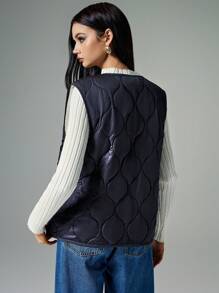 Poéselle Women's Fall/Winter Front Bow-Tie Wool-Lined Quilted Oversized Vest Jacket: A Two-Tone, Thick Sleeveless Outerwear Piece With A Center Bow Tie, Perfect For Outdoor Activities And Autumn Layering, Combining Warmth And Style In A Versatile Design. - Black - View 2