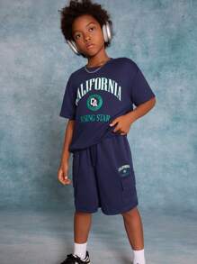 SHEIN Tween Boys' Knitted Solid Color Printed Short Sleeve T-Shirt With Pocket And Drawstring Shorts 2pcs/Set - Navy Blue - View 4
