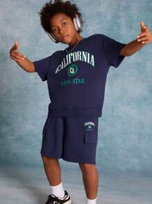 SHEIN Tween Boys' Knitted Solid Color Printed Short Sleeve T-Shirt With Pocket And Drawstring Shorts 2pcs/Set - Navy Blue - View 2