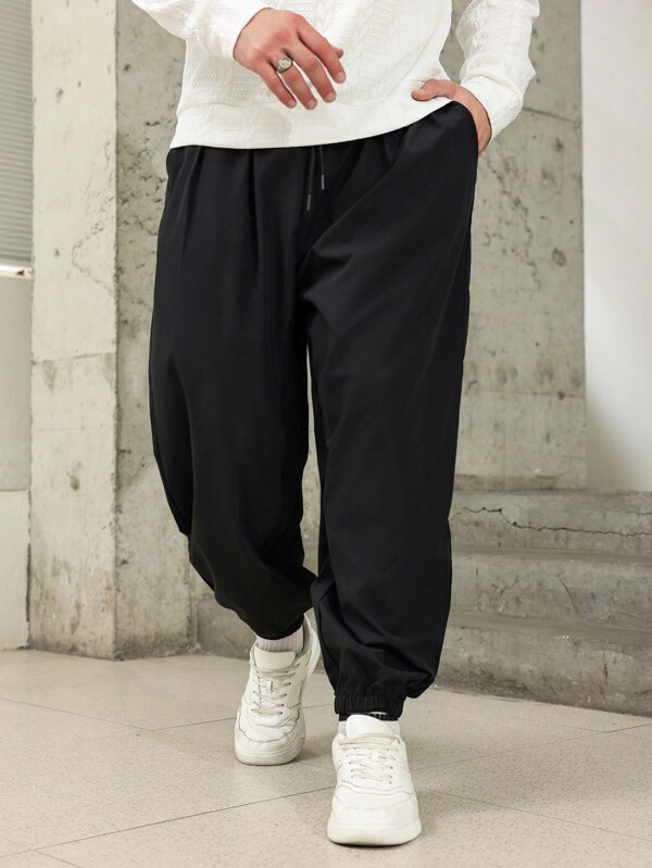 Manfinity Homme Pantalones harén de talle con cordón de unicolor talla grande para hombre, pantalones largos apilados llanos para salir, pantalones negros, regalo para esposo o novio