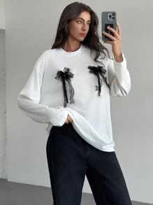 Aloruh Camiseta de manga larga con cuello redondo oversize con lazo decorativo para mujeres, primavera/verano