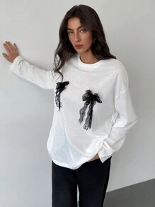 Aloruh Camiseta de manga larga con cuello redondo oversize con lazo decorativo para mujeres, primavera/verano