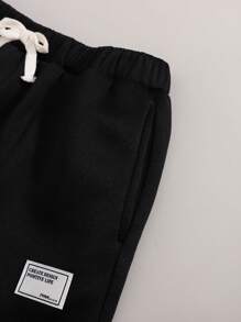 SHEIN Mua 1 tặng 1! Bộ 2 quần nỉ lót nơ thắt eo màu đen trắng cơ bản cho bé gái tuổi teen trở lại trường - Đen và trắng - Xem 5