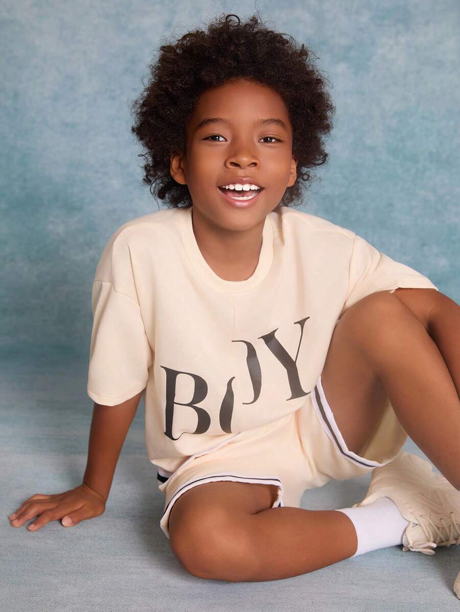 SHEIN Tween Boys' Knitted Solid Color Letter Printed Patchwork Woven Tape Short Sleeve T-Shirt And Shorts Set - Beige - View 1