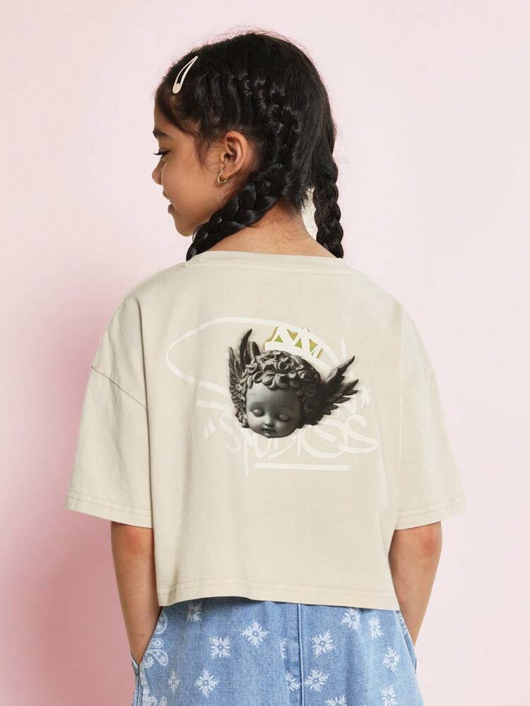ツイーンガールズ用 洗い加工クロップフィットドロップショルダー Tシャツ グラフィティ&エンジェルプリント付き
