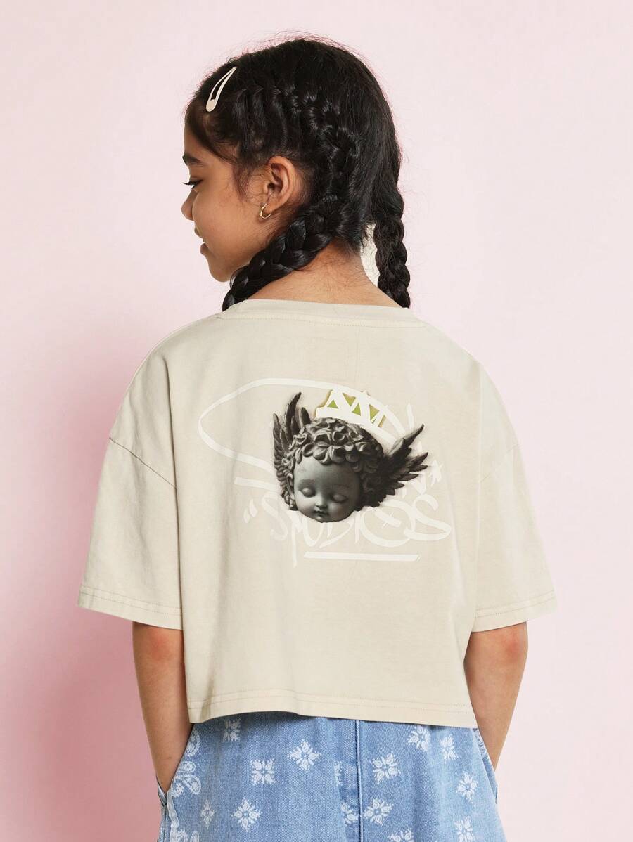 SUMWON Camiseta de niña preadolescente con hombros caídos, ajuste recortado, lavada, con estampado gráfico de graffiti y ángel